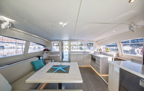Beautiful and bright salon and galley of the Leopard 434 PC