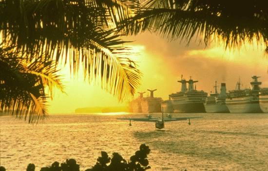 Sea plane and cruise ships in sunset