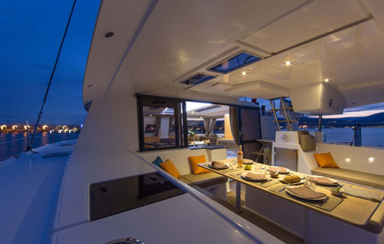 Cockpit table becomes the social center of the Helia 44